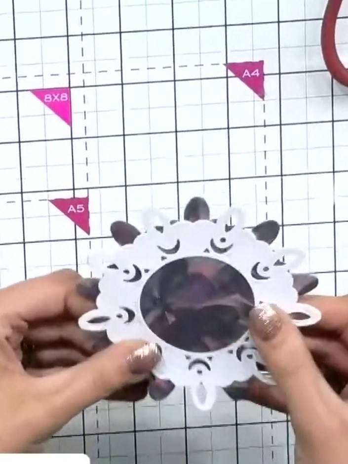 Step 2: Position the decorative die-cut frame slightly off-centre on the card front to create visual interest. Place i