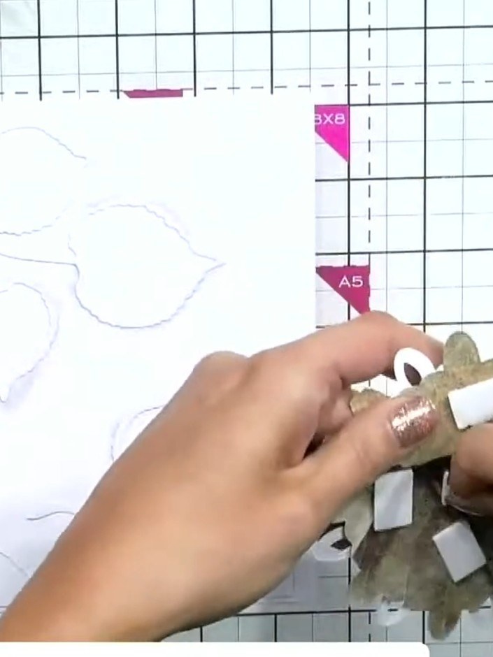 Step 4: Stamp a sentiment or image from your chosen stamp set into the circular aperture created by the die-cut design