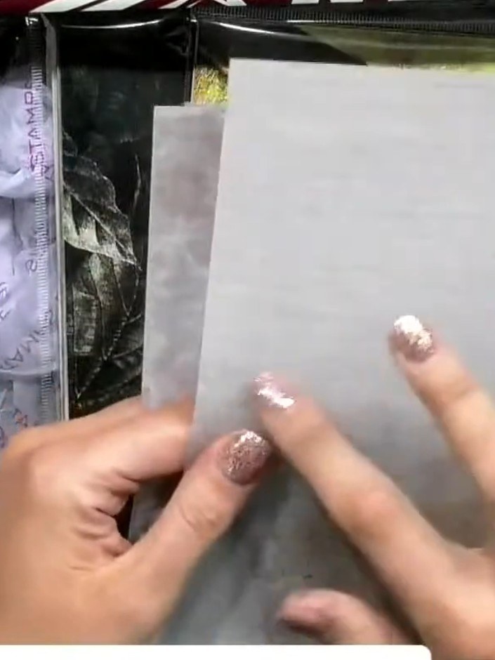 Step 6: Apply masking fluid to the vellum panel using your finger to create a textured background. Allow to dry comple