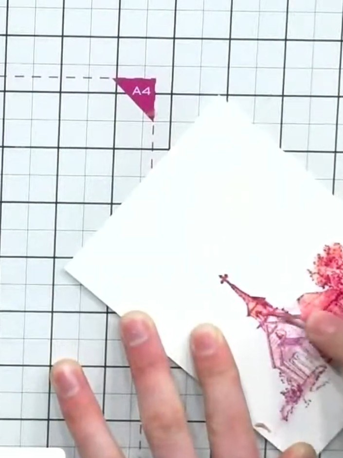 Step 4: Stamp a silhouette arch design over the masked moon area using pink ink. Carefully peel away the masking fluid