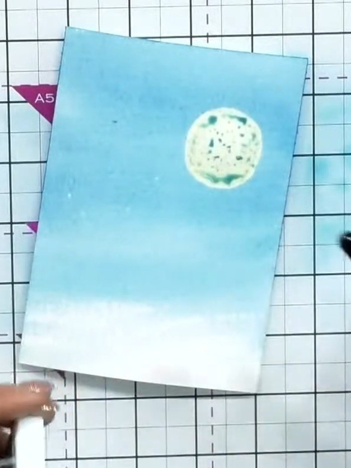 Step 3: Continue blending the blue watercolour across the panel, working the colour down towards the bottom to create 
