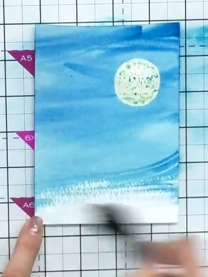 Step 4: Use a flat or round brush to blend the watercolour across the card panel, working the colour to create smooth 