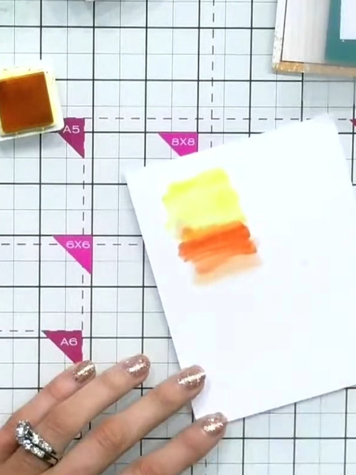 Step 4: Adhere the stamped and coloured panel to the inside of the acetate card using glue or double-sided tape. Posit