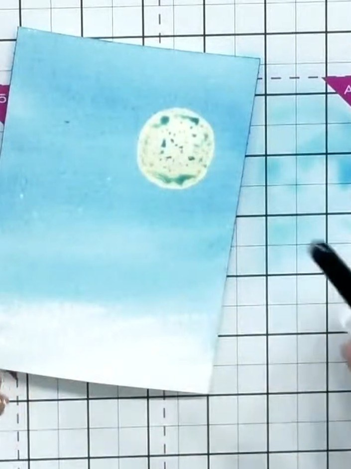 Step 4: Allow the watercolour to blend naturally with the water on the card, creating soft edges and a graduated wash 
