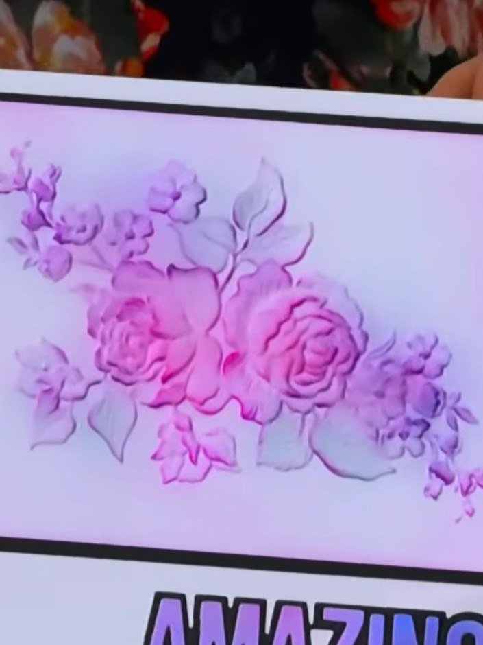 Step 3: Rub the brushes across the embossed card surface, allowing the pink and purple ink colours to blend together n