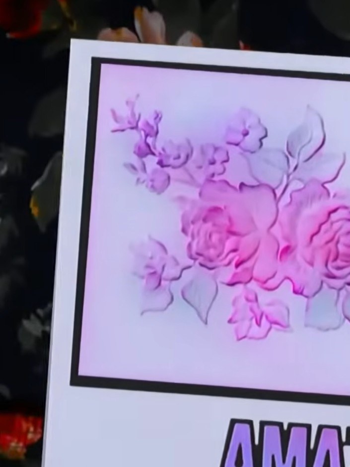 Step 4: Using a darker ink, carefully apply colour to the raised embossed areas of the floral design. This will create