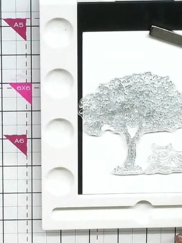 Step 1: Stamp the large tree image from the 'Under the Tree' stamp set onto white watercolour cardstock using black in