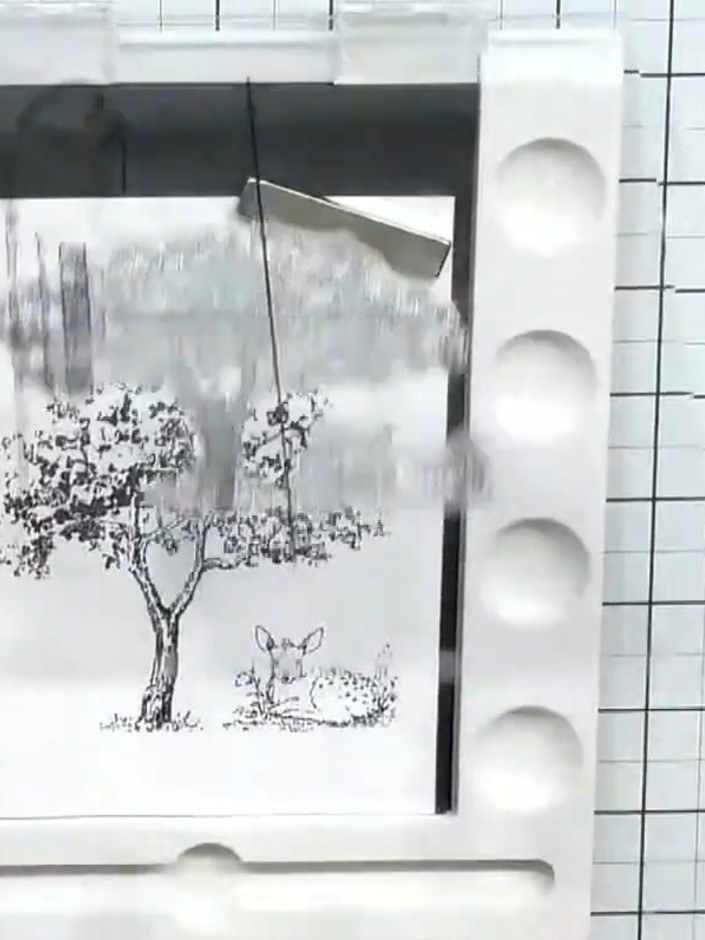 Step 2: Stamp a small animal image (such as a deer or rabbit) below the tree to create a focal point in your scene. Po