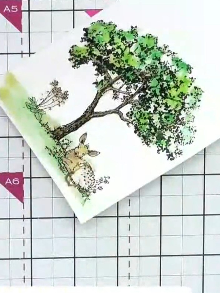 Step 8: Extend the warm yellow and green colours down to the grass area at the bottom of the card to create a reflecti