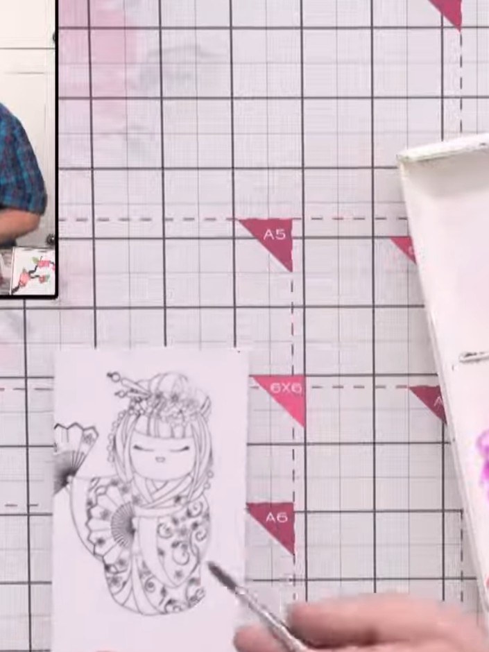 Step 11: Apply a pale purple watercolour wash to the character's outfit using a water brush. Build up depth by adding d