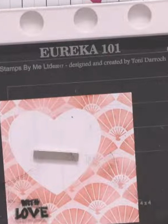 Step 8: Stamp your sentiment (such as 'With Love') in the bottom left corner of the card front using midnight black in
