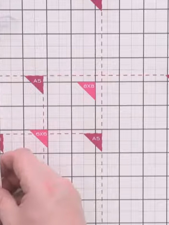 Step 1: Cut a red top fold card down to 4½ inches (11.4 cm) wide, keeping the standard length. Use a trimmer to make a