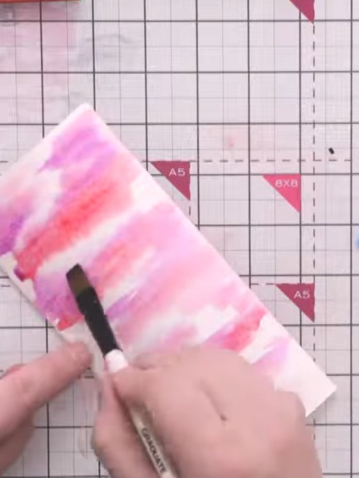 Step 14: Add deep blue watercolour to the sky area to create a moody night sky effect. Blend the colours together using