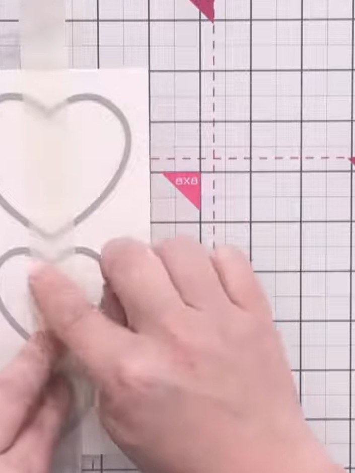Step 5: Place the watercolour card onto your cutting mat with the taped dies on top. Run through your die-cutting mach
