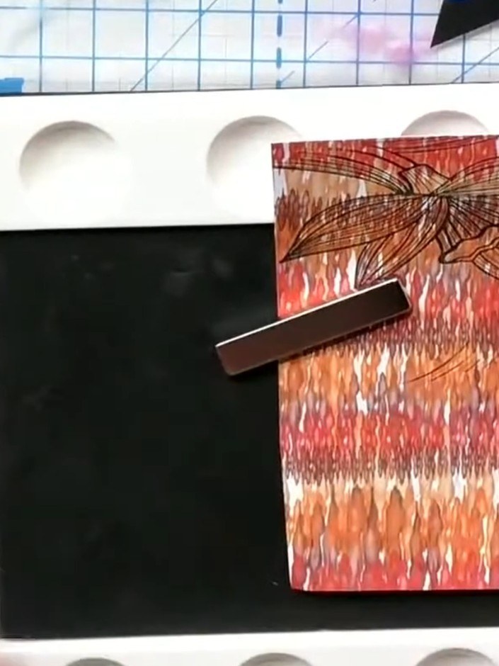 Step 6: Layer the first daffodil piece directly onto your card base, positioning it centrally on the front of the card