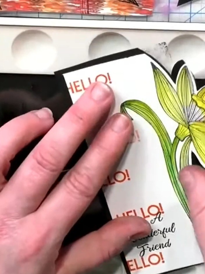 Step 7: Attach the second daffodil to the card using foam pads to create dimension. Position it over the first daffodi
