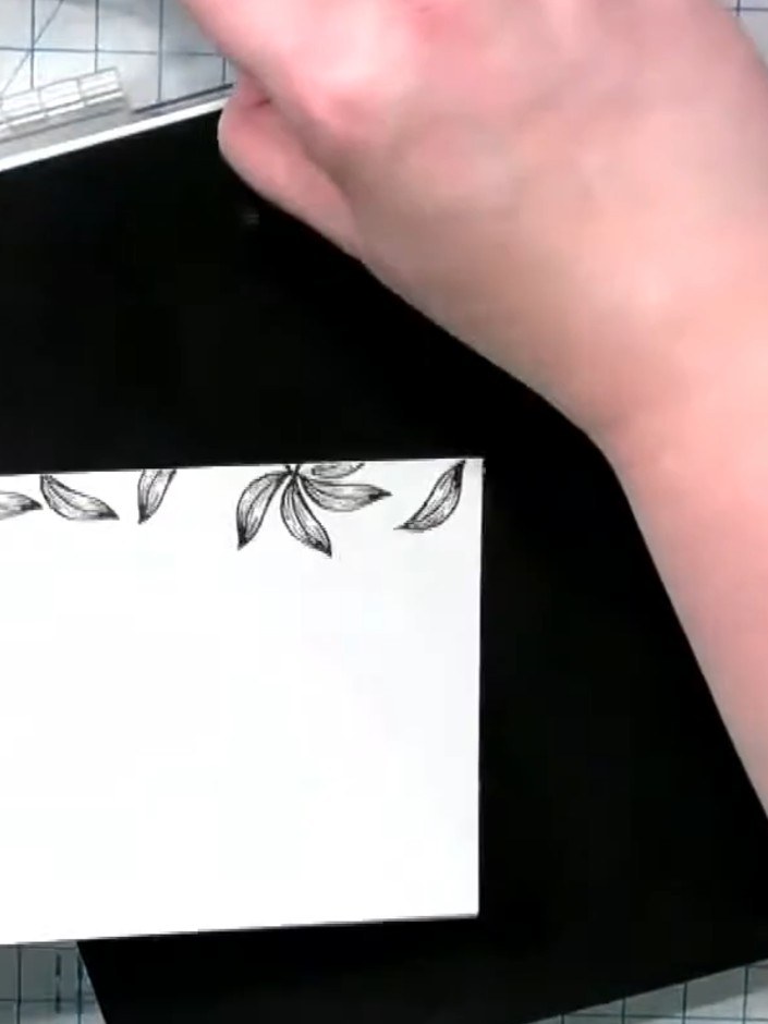 Step 1: Stamp the leaf element from the Love Lily stamp set repeatedly around the border of your white card blank, cre