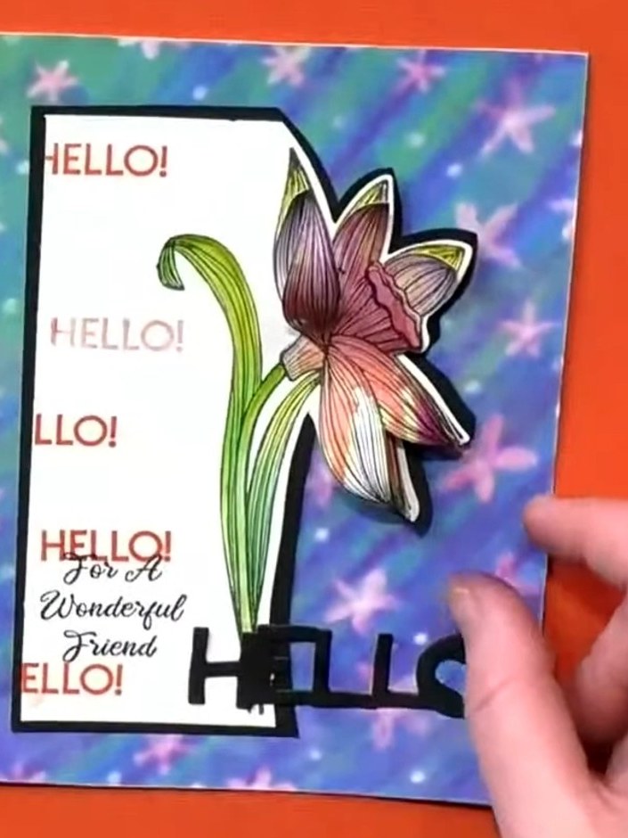 Step 4: Place the completed card design onto an orange textured cardstock background to observe how the different colo
