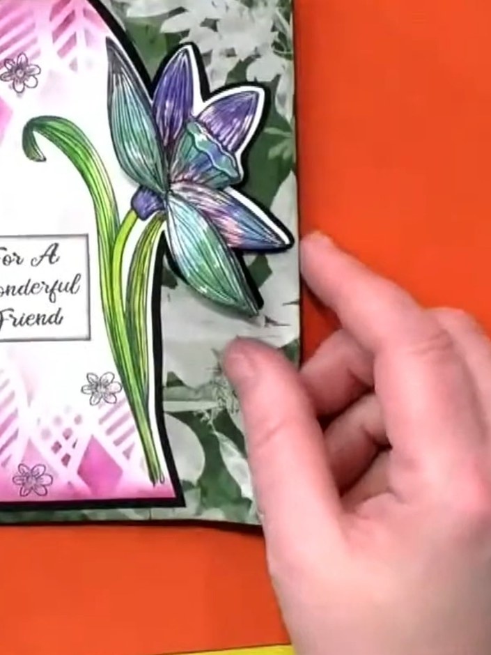 Step 5: Stamp and colour the same daffodil design on orange cardstock to see how the different background colour creat