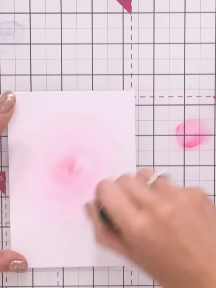 Step 1: Apply magenta ink to the centre of your white card stock using a blending brush. Work in circular motions outw