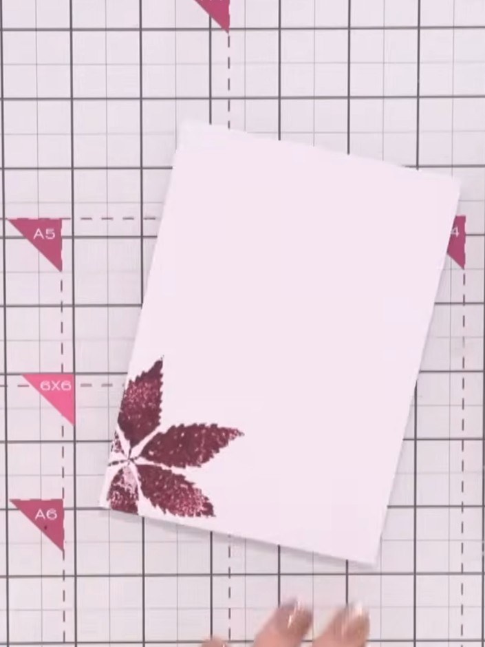 Step 2: Carefully cut out the stamped leaf image using scissors or a craft knife. Take your time to cut neatly around 