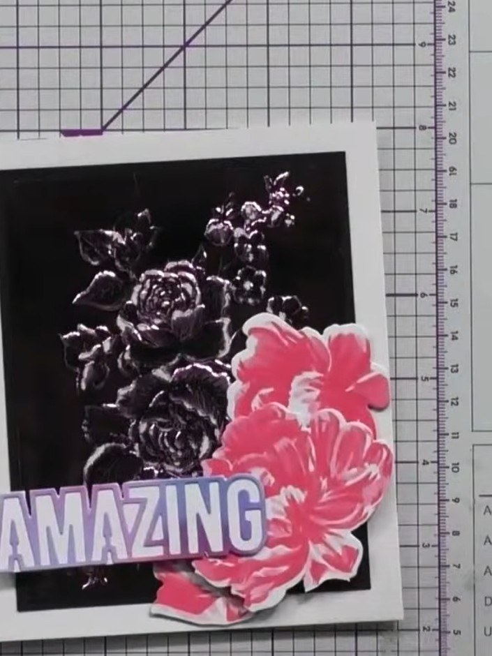 Step 1: Emboss your black metallic card using the floral embossing folder through your die-cutting machine. The emboss