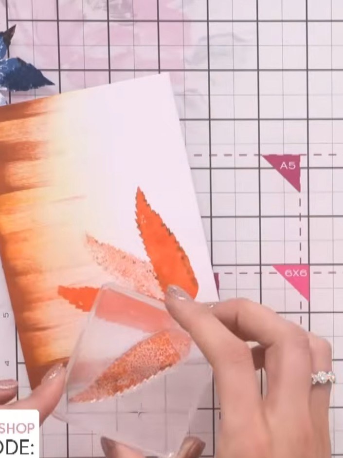 Step 7: Stamp a sentiment onto the card using the orange ink to complete the design. Position the sentiment in a clear