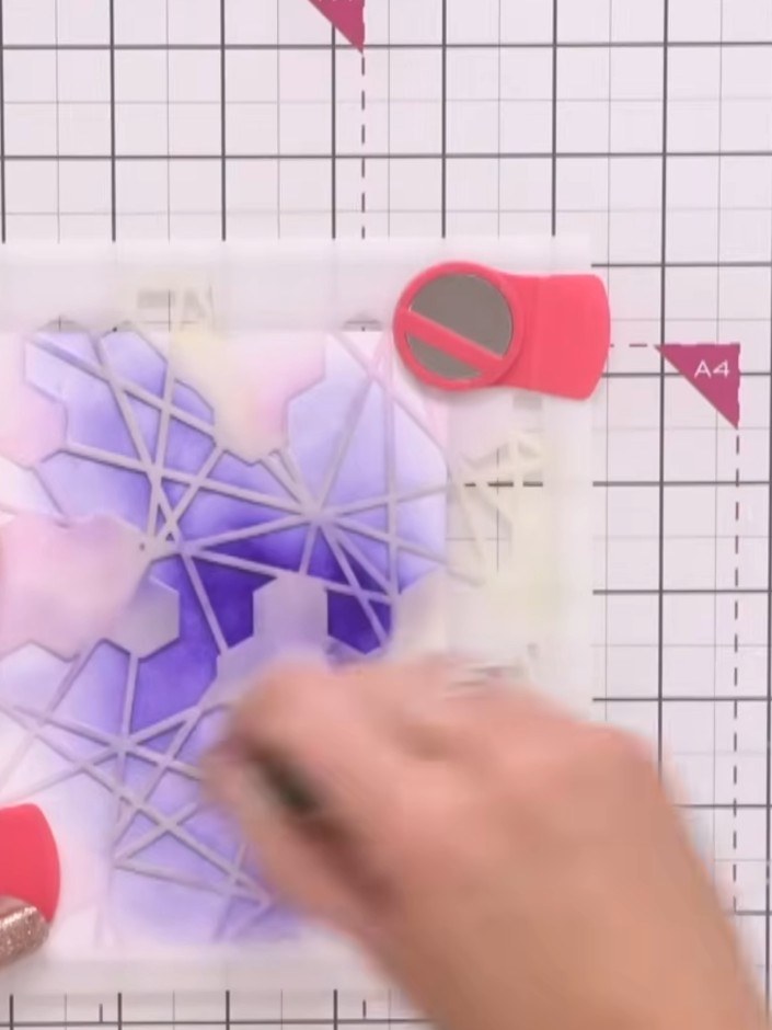 Step 2: Lightly spray the inked card with water to help blend the purple ink colours together, creating a smooth gradi
