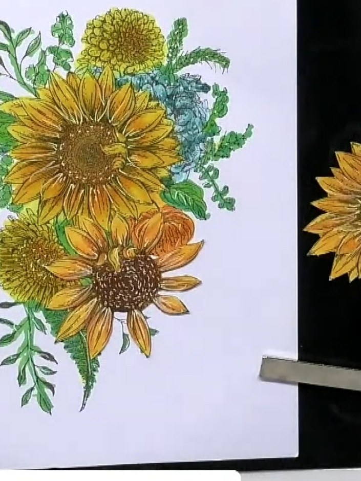 Step 2: Stamp the sunflower and floral arrangement onto white cardstock using black ink. Allow the stamped image to dr