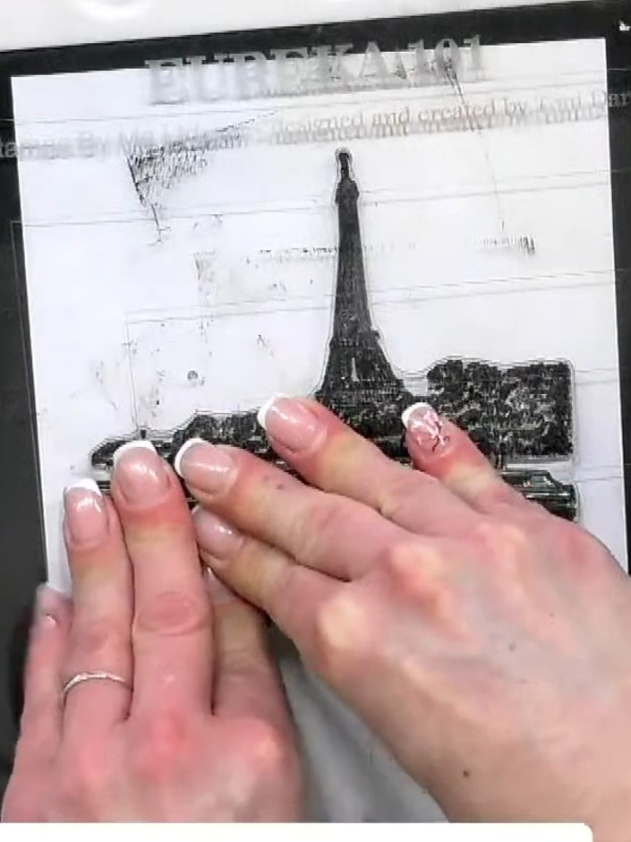 Step 2: Position the mask on your card base and stamp the Paris scene over the top using black ink. Stamp the Eiffel T