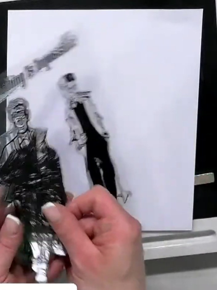 Step 2: Stamp the image onto copier paper using black ink. Apply water to the stamped image to create a watercolour wa