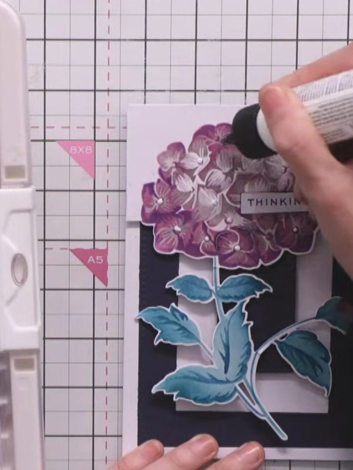 Step 10: Apply small sequins or sparkles to the centres of the hydrangea flowers using a glue pen to add sparkle and di