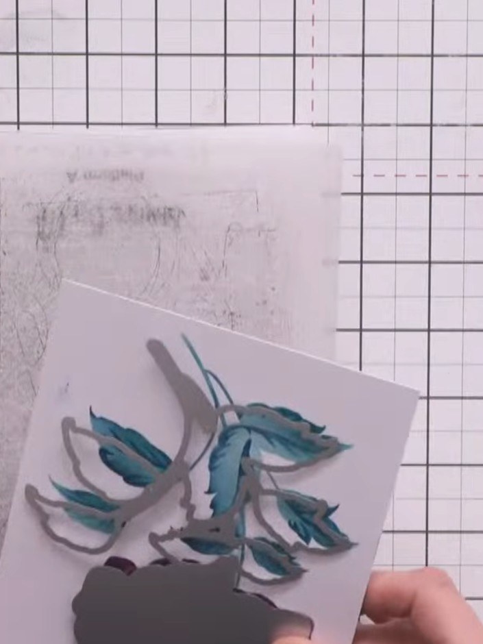 Step 6: Use the largest waste-free die to cut the stencilled image from navy card stock. Nest the next size die inside