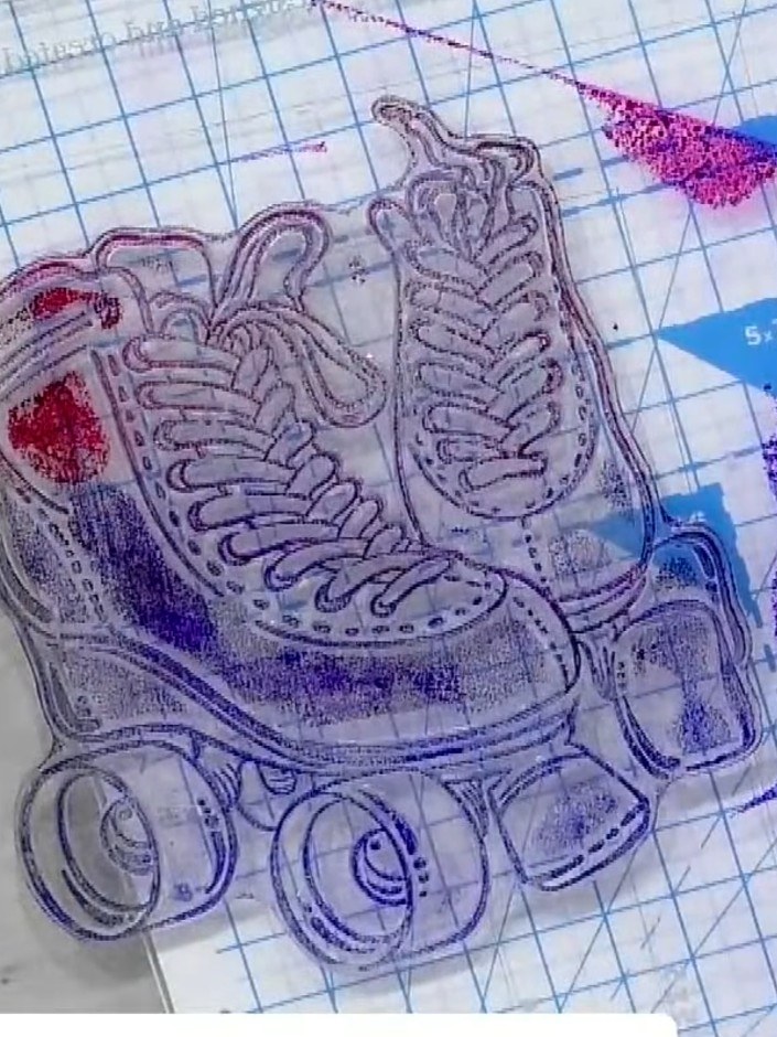 Step 1: Apply blue ink to the bottom portion of the roller skate stamp and pink or red ink to the top portion, creatin