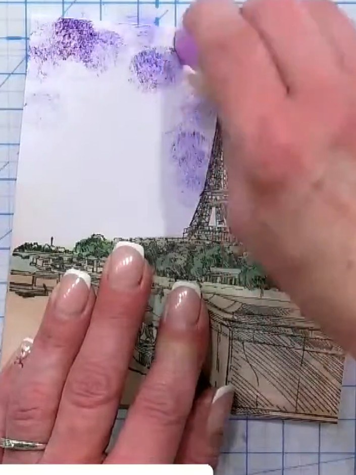 Step 4: Tap purple confetti ink over the top of the dripped ink to add additional colour layers and create depth in th