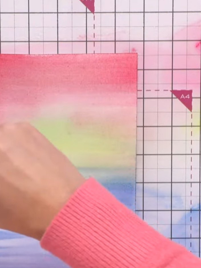 Step 5: Blend the colours together by dragging your brush across the wet watercolour surface, creating soft transition