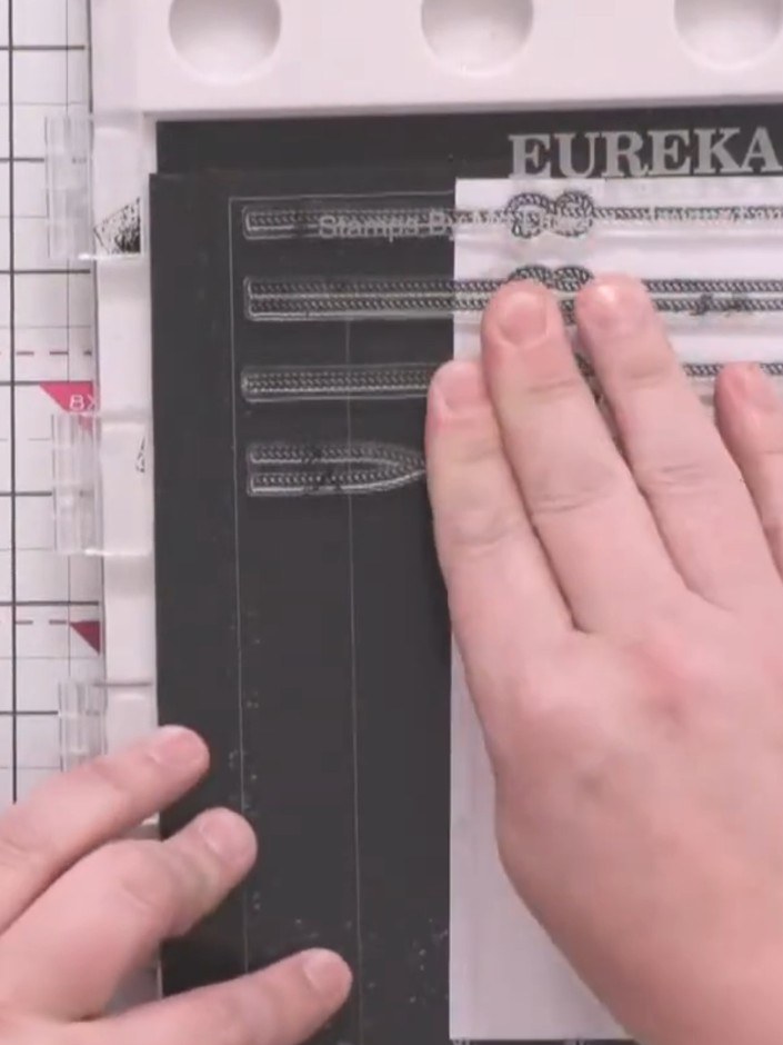 Step 3: Ink the rope stamps with midnight black ink and stamp them down the white card in horizontal rows, creating yo