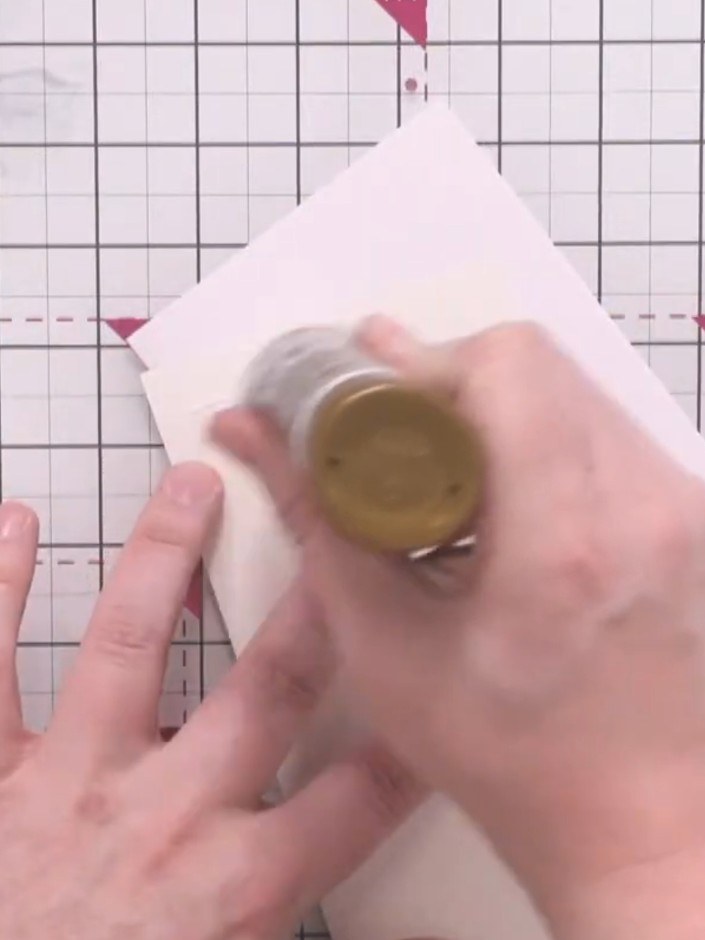 Step 7: Mount your stamped and coloured DL card onto a slightly larger piece of green glitter card using a tape runner
