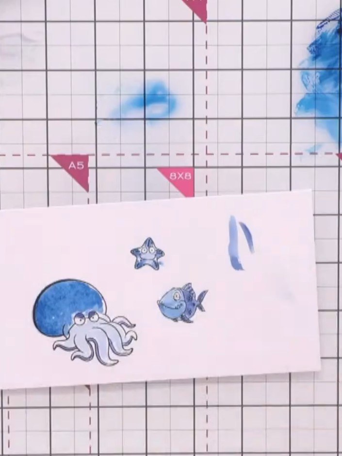 Step 12: Die-cut the watercoloured sea creatures (octopus, fish, and starfish) using their corresponding dies from the 