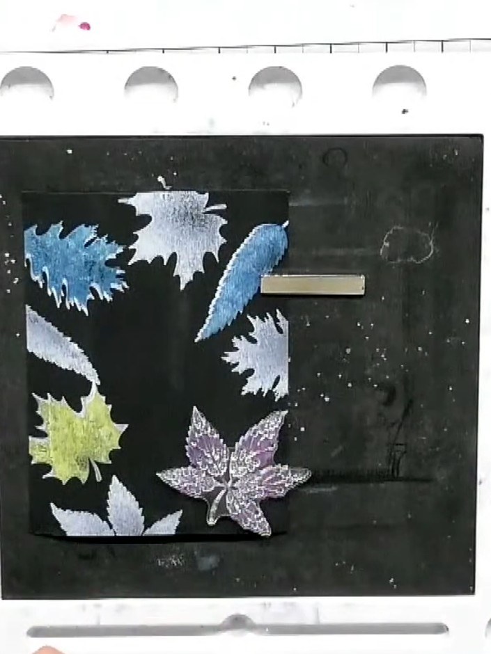 Step 1: Stamp the solid leaf images from your stamp set onto black cardstock using white embossing ink. Stamp multiple