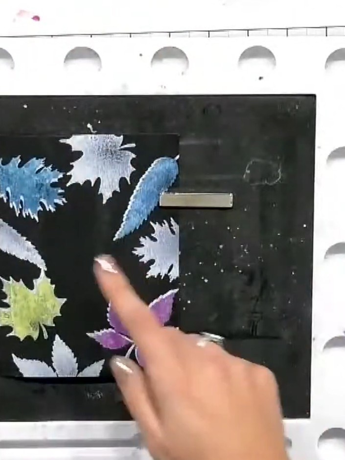 Step 2: Apply coloured ink over the white stamped leaf images to create a layered effect. Use different colours such a