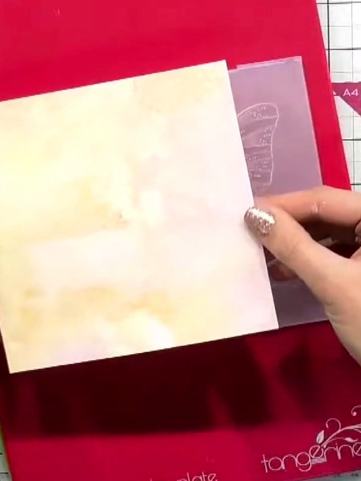 Step 1: Select a patterned cardstock from the coordinating 12 by 12 paper pad. Choose a design that complements your b