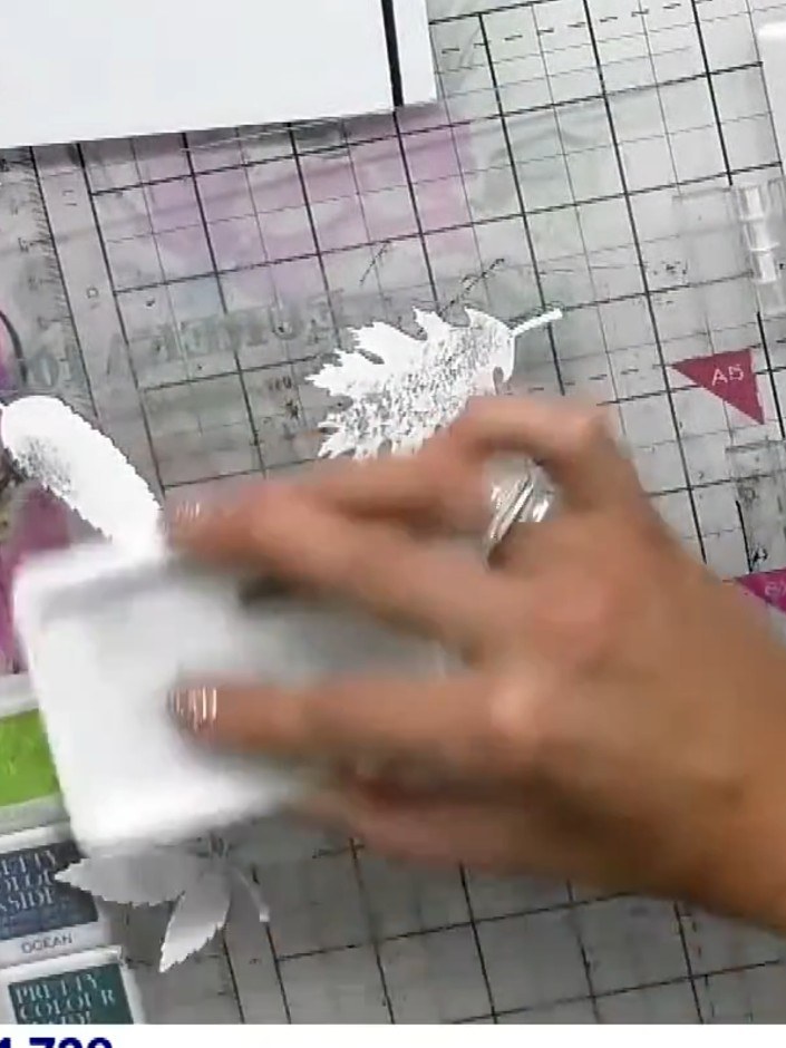 Step 3: Ink up the solid leaf stamp with white ink pad and stamp it over your black card to create an opaque white bas