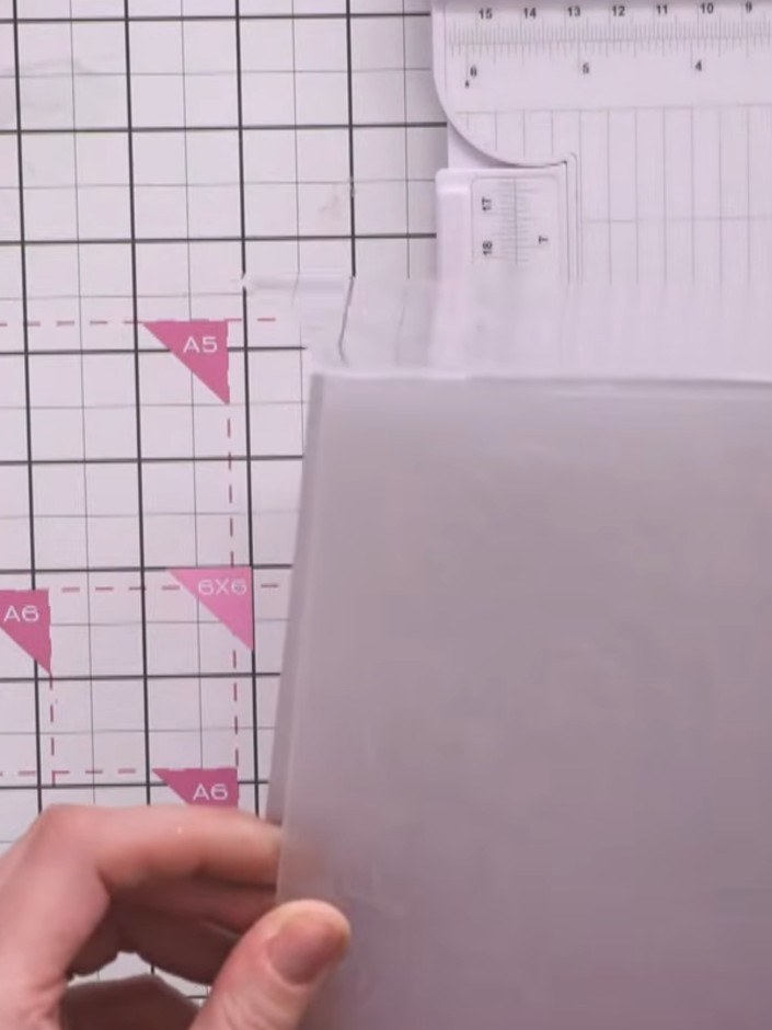 Step 1: Cut white card stock to A6 size. Place it into your chosen embossing folder (Tiger Lily or Pretty Peony) and r
