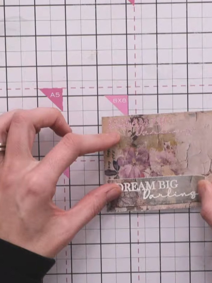 Step 8: Trim the sentiment piece to size. Edge the trimmed piece with a dark ink pad by swiping the edges to add dimen