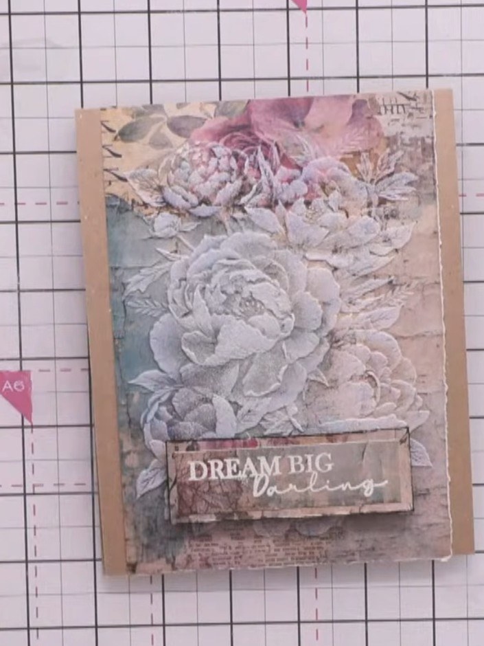 Step 9: Attach foam pads to the back of the 'DREAM BIG Darling' sentiment piece and adhere it to the centre of the mai