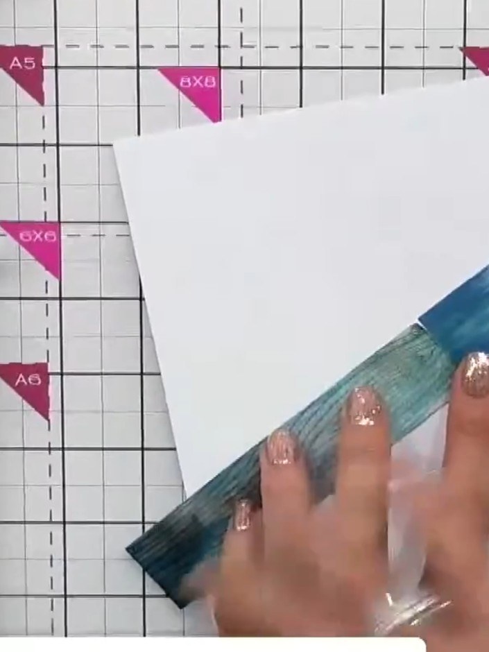 Step 6: Arrange the individual wood grain panels on your white card base. Position them diagonally across the card, ov