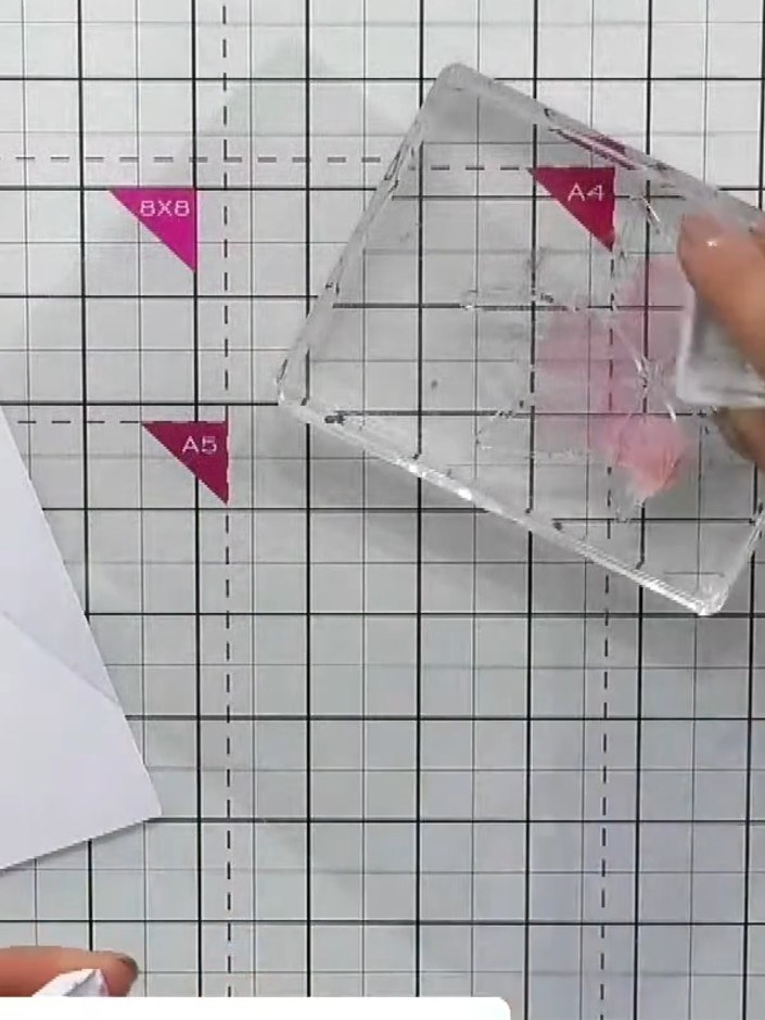 Step 2: Ink up the solid leaf element of the stamp with your chosen pink or purple ink, ensuring even coverage across 