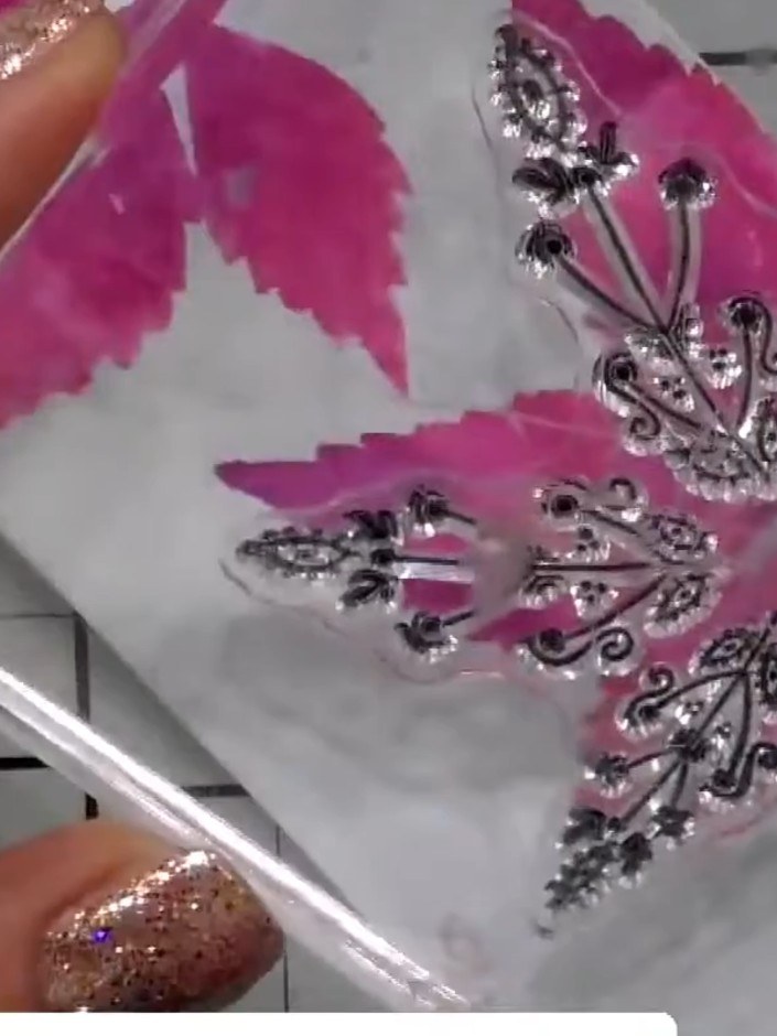 Step 9: Apply embossing ink to the stamped leaf images using an ink pad. Sprinkle embossing powder over the wet ink an