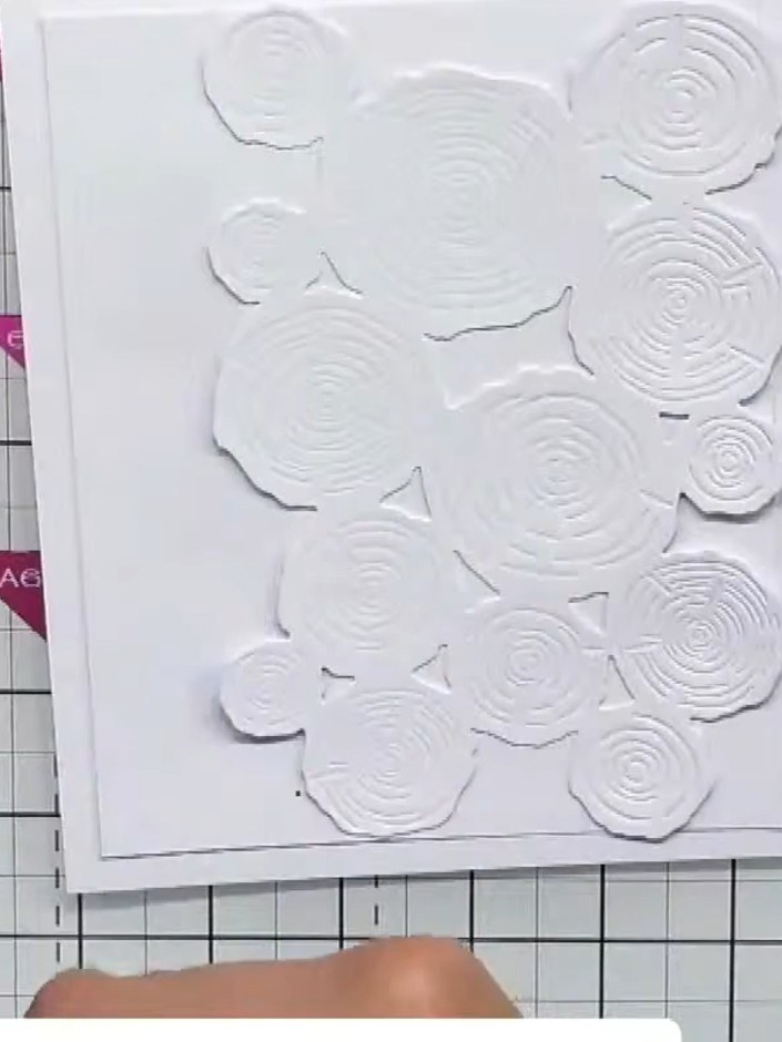 Step 5: Select your tab punch from the Stamps By Me Tab Punch Collection. The tabs feature embossed circular patterns 